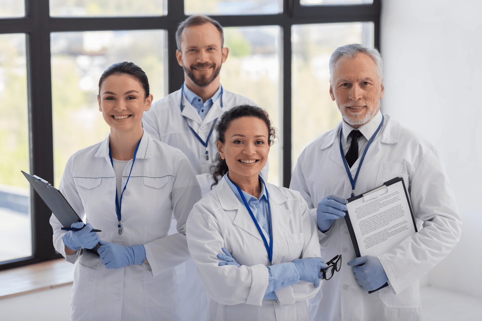 Team of diverse healthcare professionals collaborating in a clinical environment